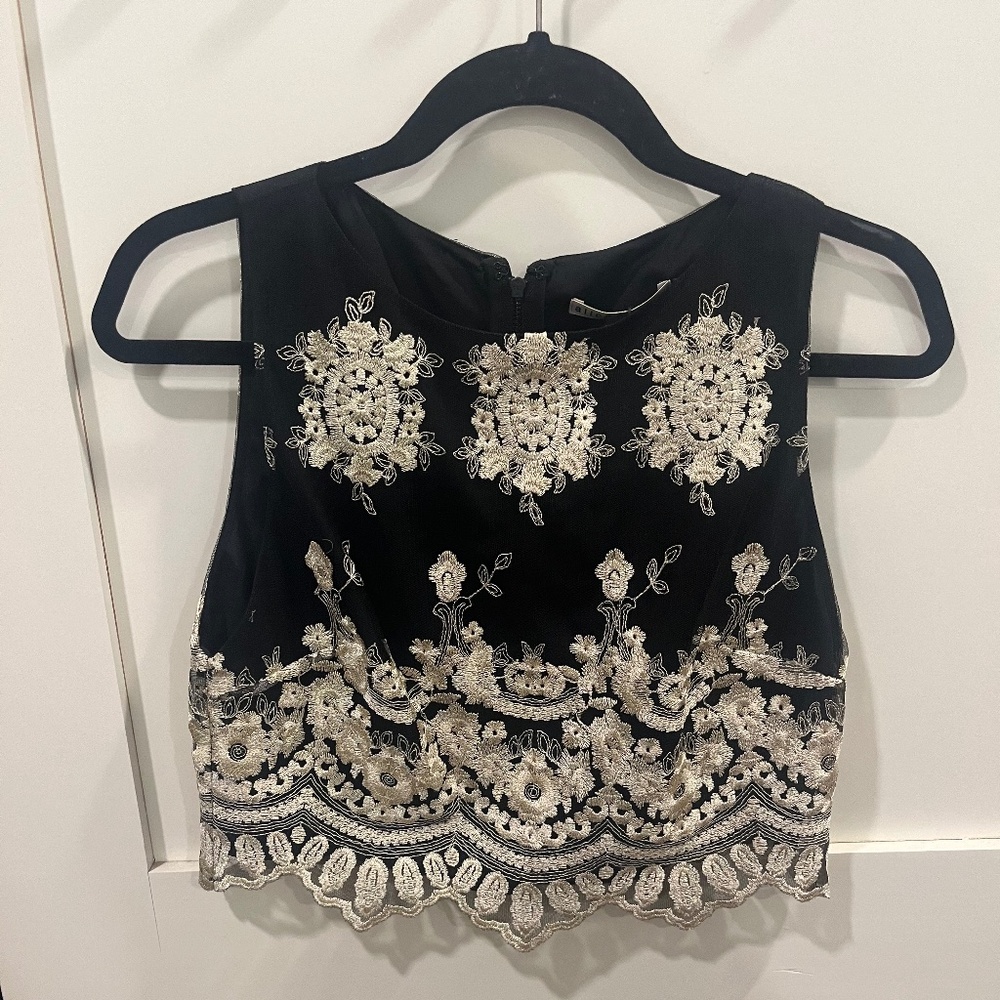 Beautiful Black and Gold top- perfect for upcoming Holiday Parties. NWT